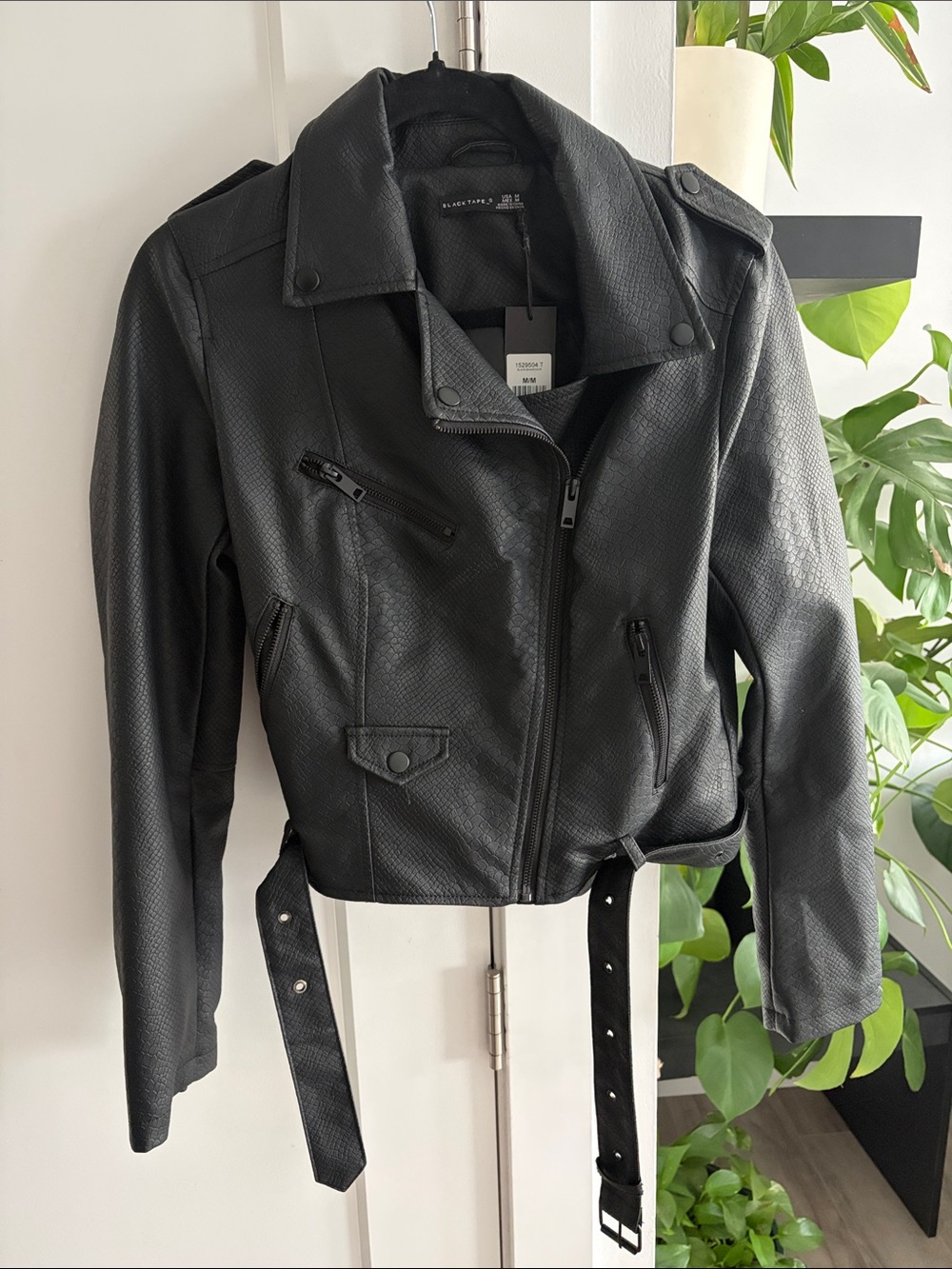 Black Tape_ Black Faux Leather Biker Jacket with Belt